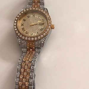 Women watch, looks like Diamond and Gold all over the watch